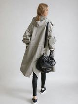 Women's Water-Repellent Hooded Trench Coat with Long Oversized Fit and Button-Up Front